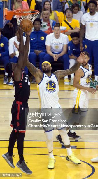 Pascal Siakam grabs a rebound ahead of DeMarcus Cousins in the first half as the Golden State Warriors played Toronto Raptors in Game 3 of the 2019...