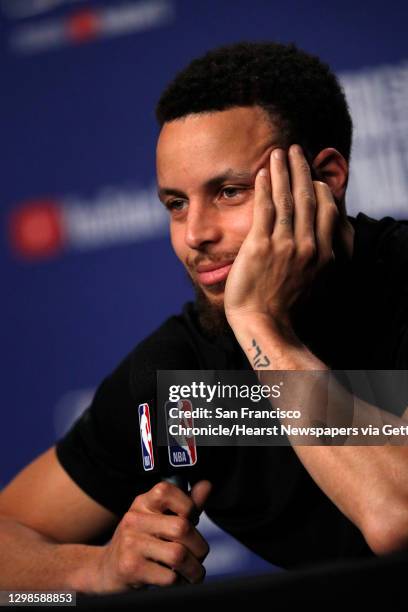 Stephen Curry listens to a reporter as he answers questions from the press as the Golden State Warriors and Toronto Raptors practiced before Game 5...