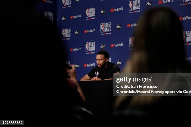 Stephen Curry answers questions from the press as the Golden State Warriors and Toronto Raptors practiced before Game 5 of the 2019 NBA Finals at...