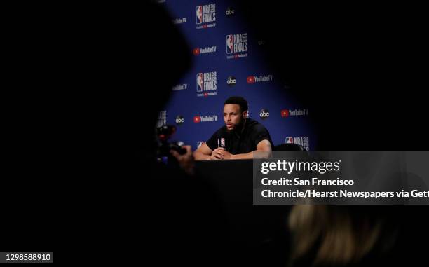 Stephen Curry answers questions from the press as the Golden State Warriors and Toronto Raptors practiced before Game 5 of the 2019 NBA Finals at...