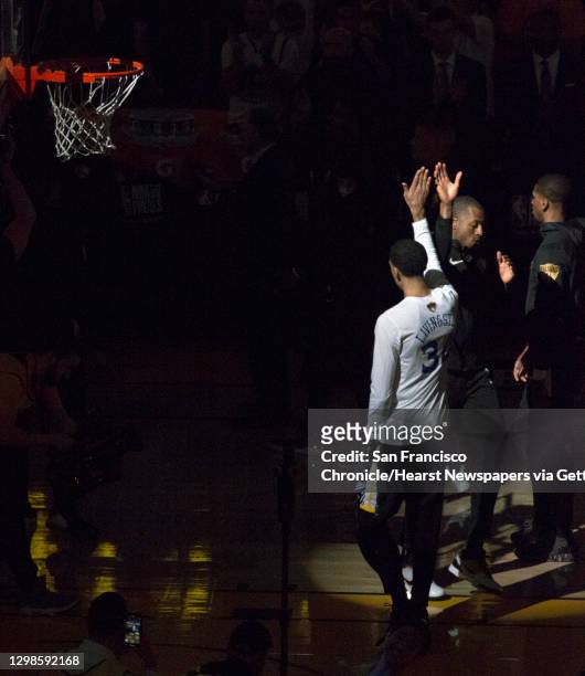 Andre Iguodala high fives Shaun Livingston as he is introduced before the game as the Golden State Warriors played Toronto Raptors in Game 4 of the...