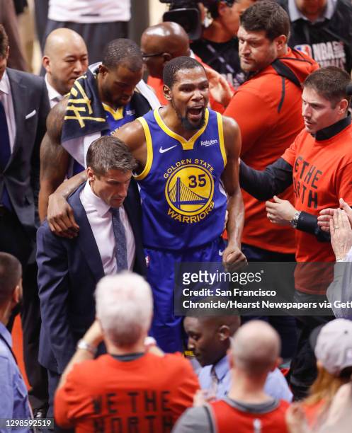 Golden State Warriors Kevin Durant leaves the game in the second quarter during game 5 of the NBA Finals between the Golden State Warriors and the...
