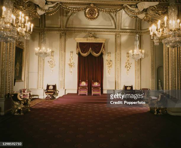 View of the Throne Room, containing the two throne Chairs of Estate, at Buckingham Palace, London residence of King George VI, August 1947.