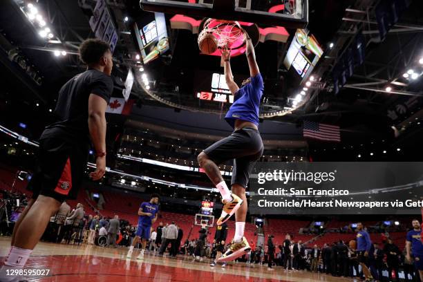 Kevon Looney duinks during warmups before the Golden State Warriors played the Toronto Raptors in Game 2 of the 2019 NBA Finals at Scotiabank Arena...