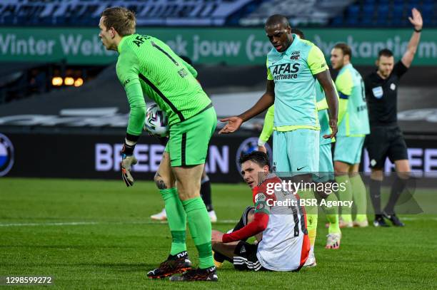 Steven Berghuis of Feyenoord sitting on pitch, Bruno Martins Indi of AZ during the Dutch Eredivisie match between Feyenoord and AZ Alkmaar at De Kuip...
