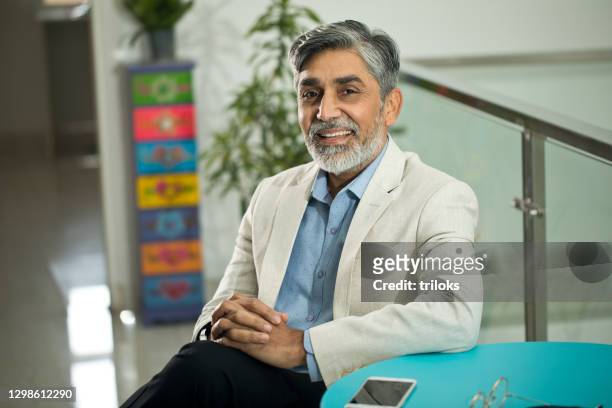 confident businessman looking at camera - asian business man stock pictures, royalty-free photos & images