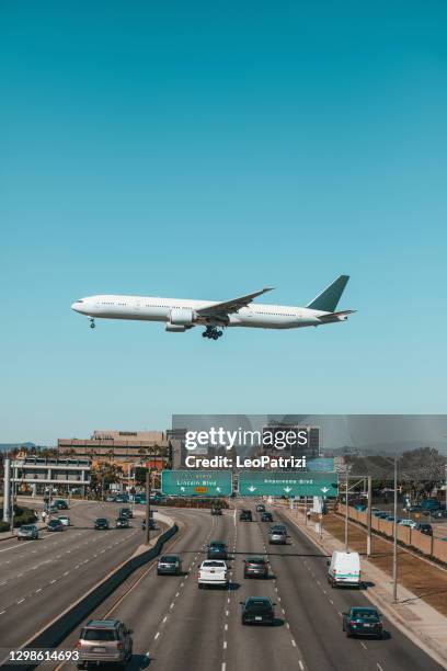 international flight arrives in los angeles lax airport - leaving california stock pictures, royalty-free photos & images