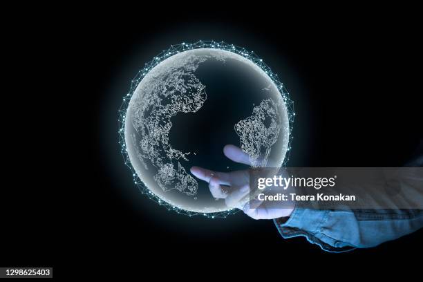 a man holds a globe that connects a network of information forwarding to the world - center for asian american media stock pictures, royalty-free photos & images