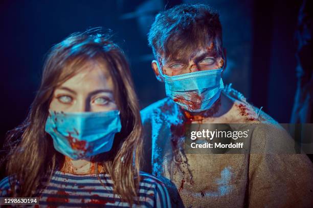 portrait of horrible dead couple. zombie illness chronicle - scary bloody stock pictures, royalty-free photos & images