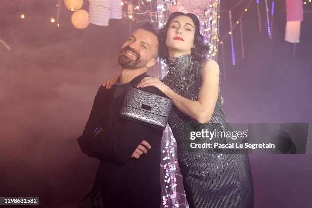 In this image released on January 26th, designer Julien Fournie and model Angeliki Tsionou poses during the Julien Fournie Haute Couture...