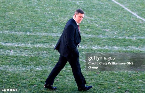 Mark McGhee makes his way across the frozen Fir Park pitch as echo's of last season begin with the postponement of the SPL clash between Motherwell...