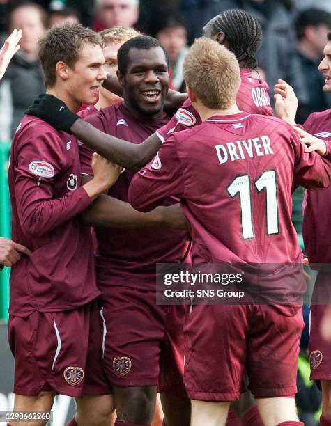 V HEARTS .EASTER ROAD - EDINBURGH .Christian Nade is mobbed by his Hearts team-mates after opening the scoring