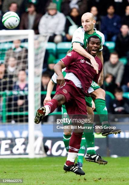 V HEARTS .EASTER ROAD - EDINBURGH .Hibs skipper Rob Jones gets to grips with Christian Nade