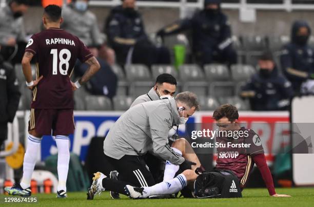 Diego Llorente of Leeds United receives medical treatment and is later forced off with a injury during the Premier League match between Newcastle...