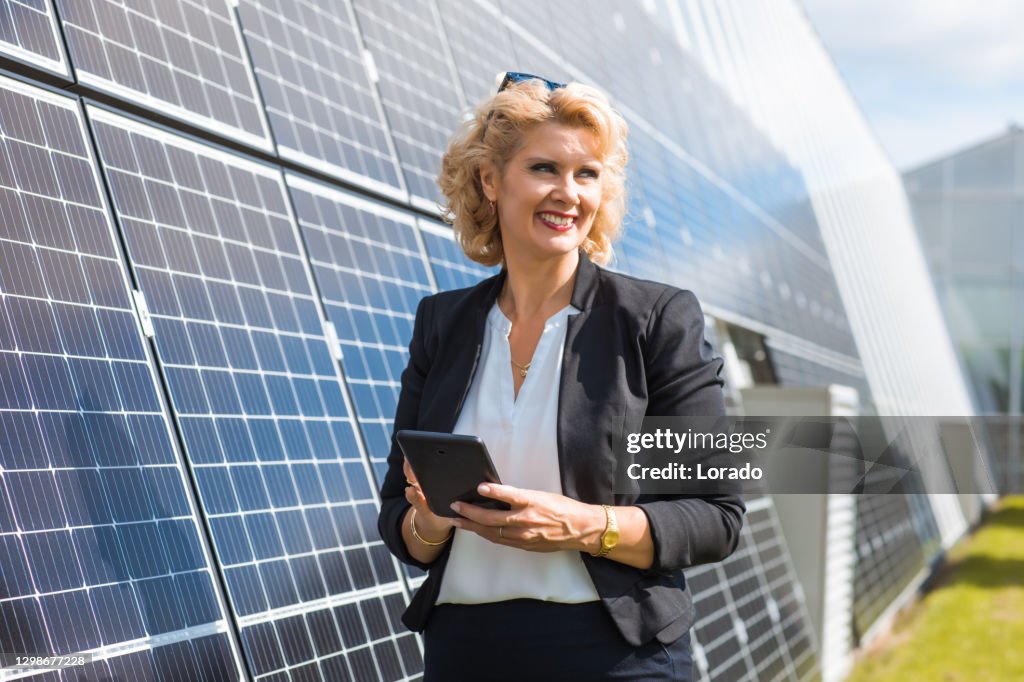 A female manager engineer on a solar panel site