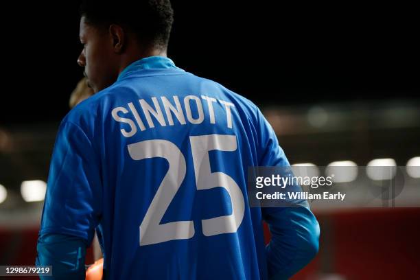 Huddersfield Town players warm up wearing a shirt with 'Sinnott 25' on the back in memory of ex-Huddersfield Town player, Jordan Sinnott, a year...