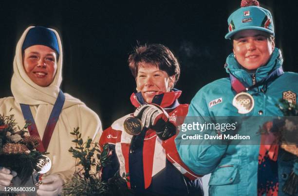 Svetlana Gladysheva of Russia, Diann Roffe of the USA, and Isolde Kostner of Italy celebrate their medals in the Women's Super G event of the Alpine...