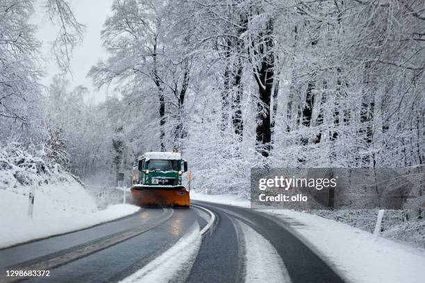 bad road conditions and traffic obstructions during heavy snowfall in germany - snowplough stock pictures, royalty-free photos & images