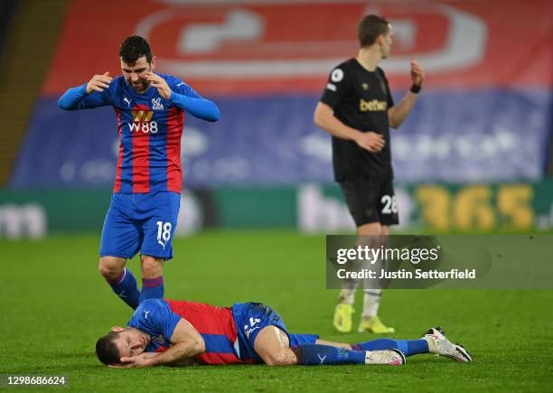 James McArthur of Crystal Palace checks on Gary Cahill of Crystal Palace who goes down injured holding his head during the Premier League match...