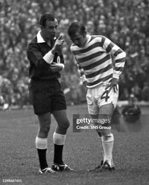 Celtic's Bobby Murdoch is warned by the referee.