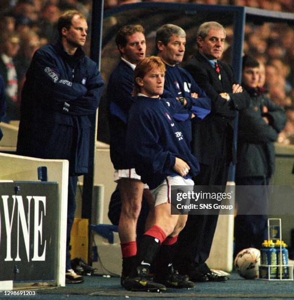 V MOTHERWELL .IBROX - GLASGOW.Rangers manager Walter Smith watches the match from the dugout alongside Archie Knox, Paul Gascoigne, Tommy Moller...