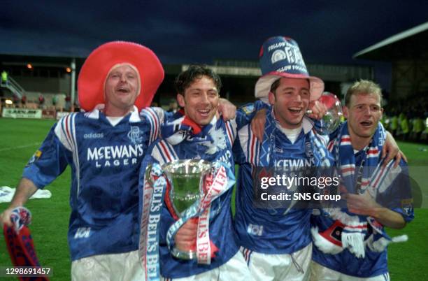 Paul Gascoigne , Derek McInnes, Ally McCoist and Gordon Durie celebrate Rangers' ninth consecutive league championship victory.