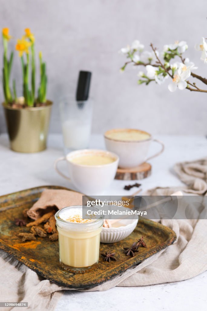 Tumeric Golden Milk Chai Latte Kurkuma Tea with Milk in spring