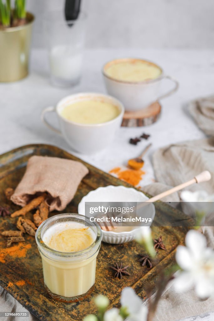 Tumeric Golden Milk Chai Latte Kurkuma Tea with Milk in spring