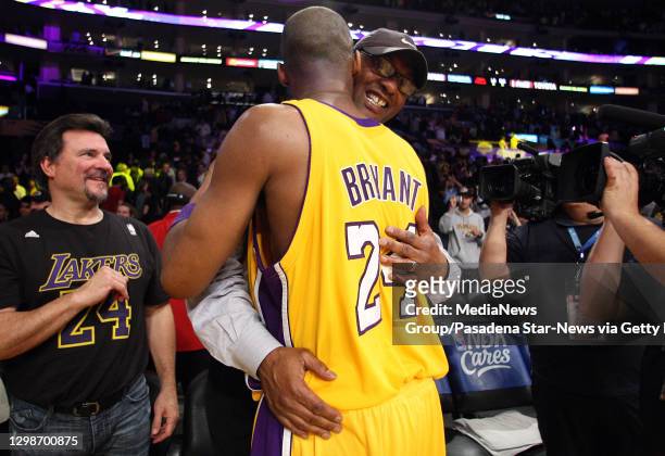 Los Angeles, CA Los Angeles Lakers guard Kobe Bryant hugs his father Joe Bryant after game two of a Western Conference first Round Playoff basketball...
