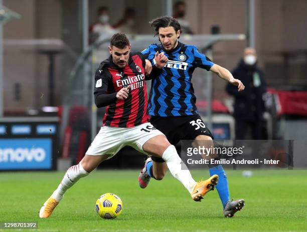 Matteo Darmian competes for the ball with Theo Hernández of AC Milan during the Coppa Italia match between FC Internazionale and AC Milan at Stadio...