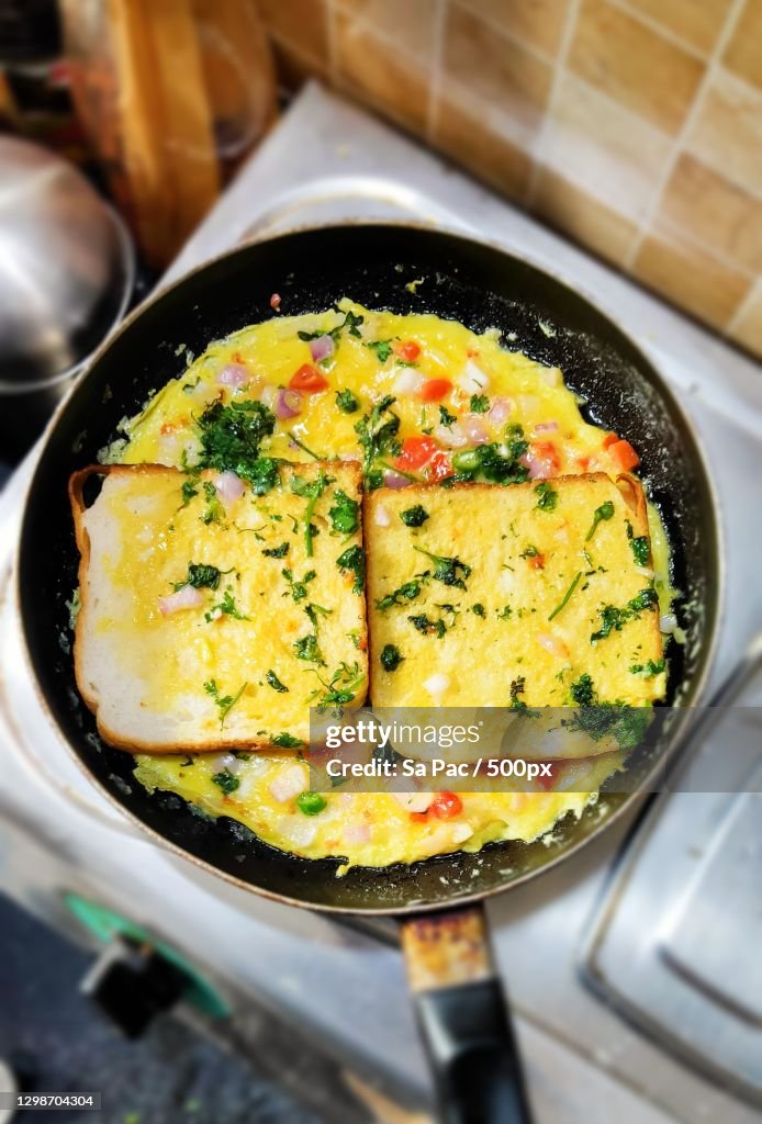 High angle view of food in cooking pan on stove