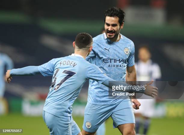 Ilkay Guendogan of Manchester City celebrates with Phil Foden after scoring their team's first goal during the Premier League match between West...