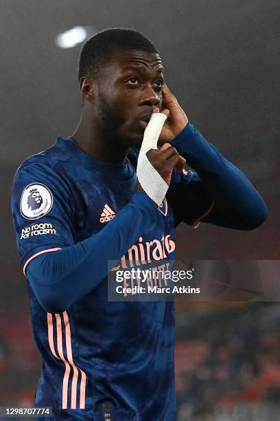 Nicolas Pepe of Arsenal celebrates after scoring his team's first goal during the Premier League match between Southampton and Arsenal at St Mary's...