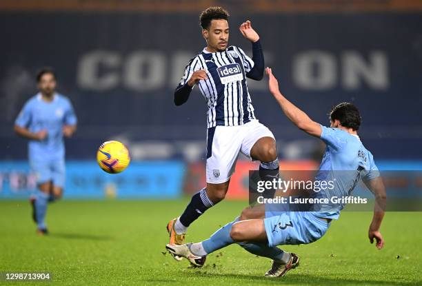 Matheus Pereira of West Bromwich Albion is challenged by Ruben Dias of Manchester City during the Premier League match between West Bromwich Albion...