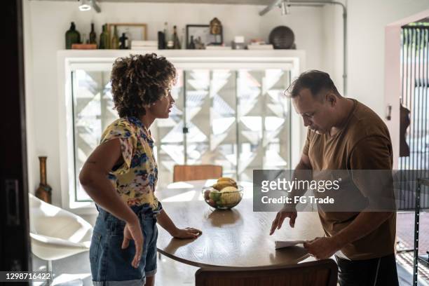 couple at home arguing about home finances - demonstration against the marriage for all bill stock pictures, royalty-free photos & images