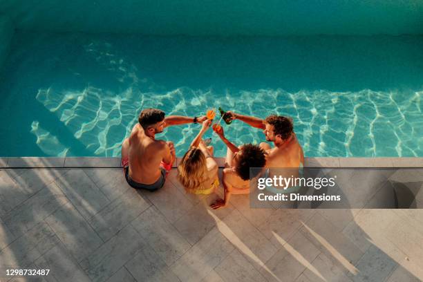 cheers to the weekend - friends poolside stock pictures, royalty-free photos & images