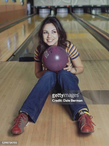 Actress Mila Kunis poses for a portrait at a bowling alley in Hollywood, CA on .