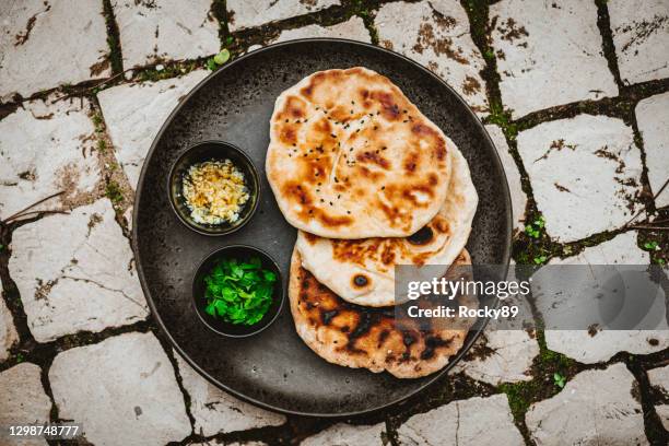 traditional indian naan flatbread - naan bread stock pictures, royalty-free photos & images