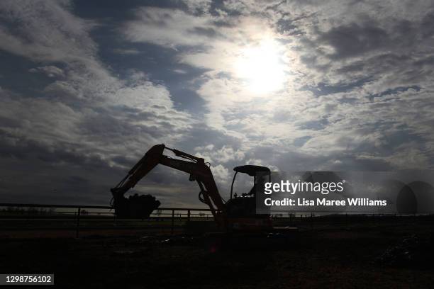 Molly Penfold operates an earth mover during daily duties at 'Old Bombine' on January 18, 2021 in Meandarra, Australia. COVID-19 and the recent...