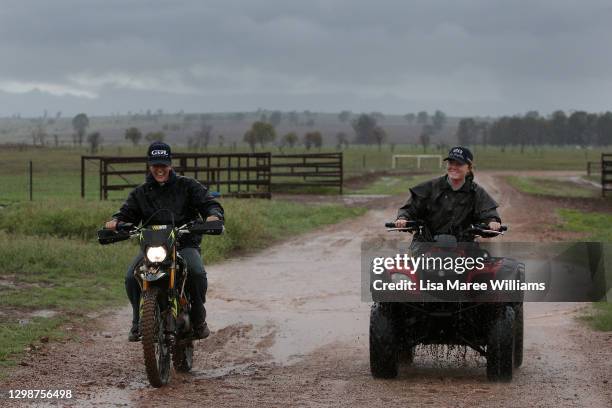 Maddie Stiller and Jemima Penfold ride through some much needed rain at 'Old Bombine' on January 18, 2021 in Meandarra, Australia. COVID-19 and the...