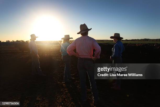 Sisters Bonnie, Jemima, Molly and Matilda Penfold oversee cattle yards at Old Bombine on January 19, 2021 in Meandarra, Australia. COVID-19 and the...