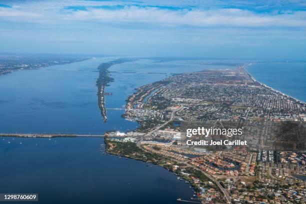 aerial view of indian river and atlantic ocean above melbourne, florida - florida bridge stock pictures, royalty-free photos & images