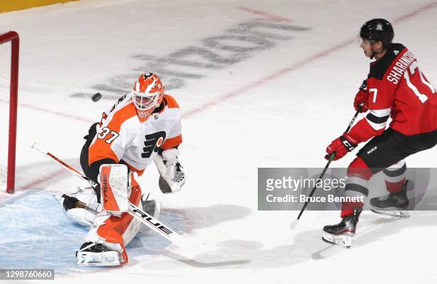 Yegor Sharangovich of the New Jersey Devils sends a shot off the crossbar during a shorthanded breakaway during the first period against Brian...