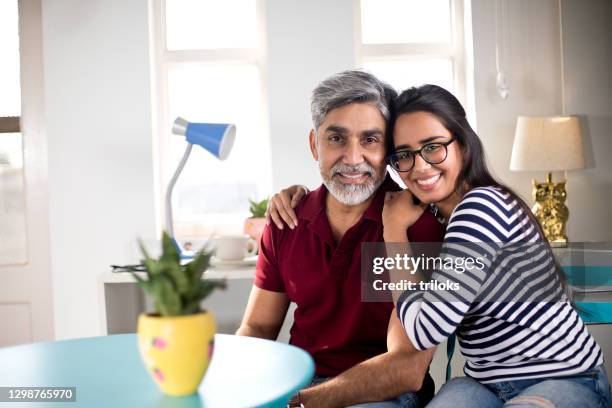 loving father and daughter at home - daughter dad stock pictures, royalty-free photos & images