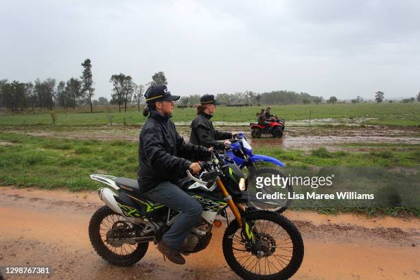 Maddie Stiller and Bonnie Penfold muster cattle towards a holding yard at 'Old Bombine' on January 18, 2021 in Meandarra, Australia. COVID-19 and the...