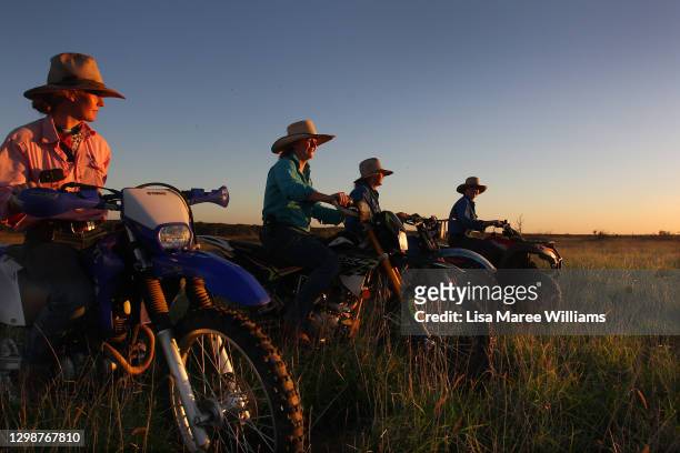 Sisters Bonnie, Jemima, Matilda and Molly Penfold ride through an open paddock at Old Bombine on January 19, 2021 in Meandarra, Australia. COVID-19...