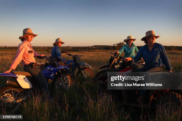 Sisters Bonnie, Jemima, Matilda and Molly Penfold take in the sunset during a ride at 'Old Bombine' on January 19, 2021 in Meandarra, Australia....