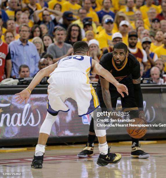 Golden State Warriors' Stephen Curry guards Cleveland Cavaliers' Kyrie Irving in the fourth quarter during Game 7 of the NBA Finals at Oracle Arena...