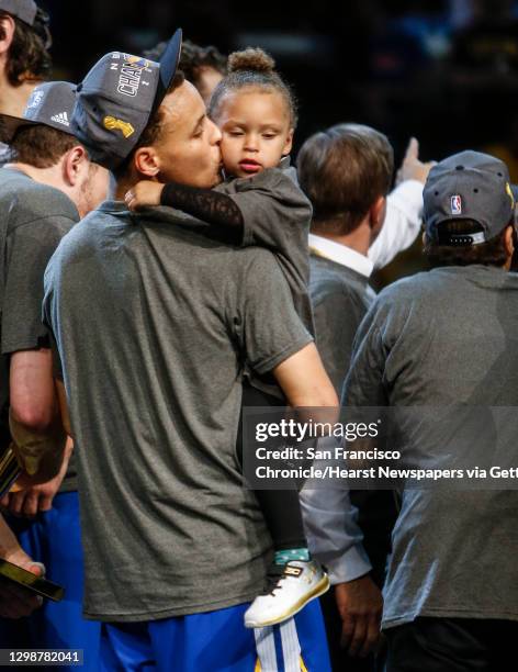 Golden State Warriors' Stephen Curry kisses his daughter, Riley, after Game 6 of The NBA Finals between the Golden State Warriors and Cleveland...