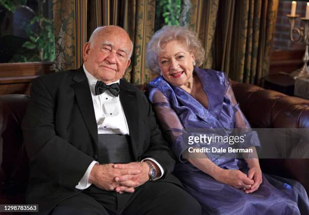 Actress Betty White and actor Ed Asner poses for a portrait on the Hot in Cleveland set in Studio City, CA on .